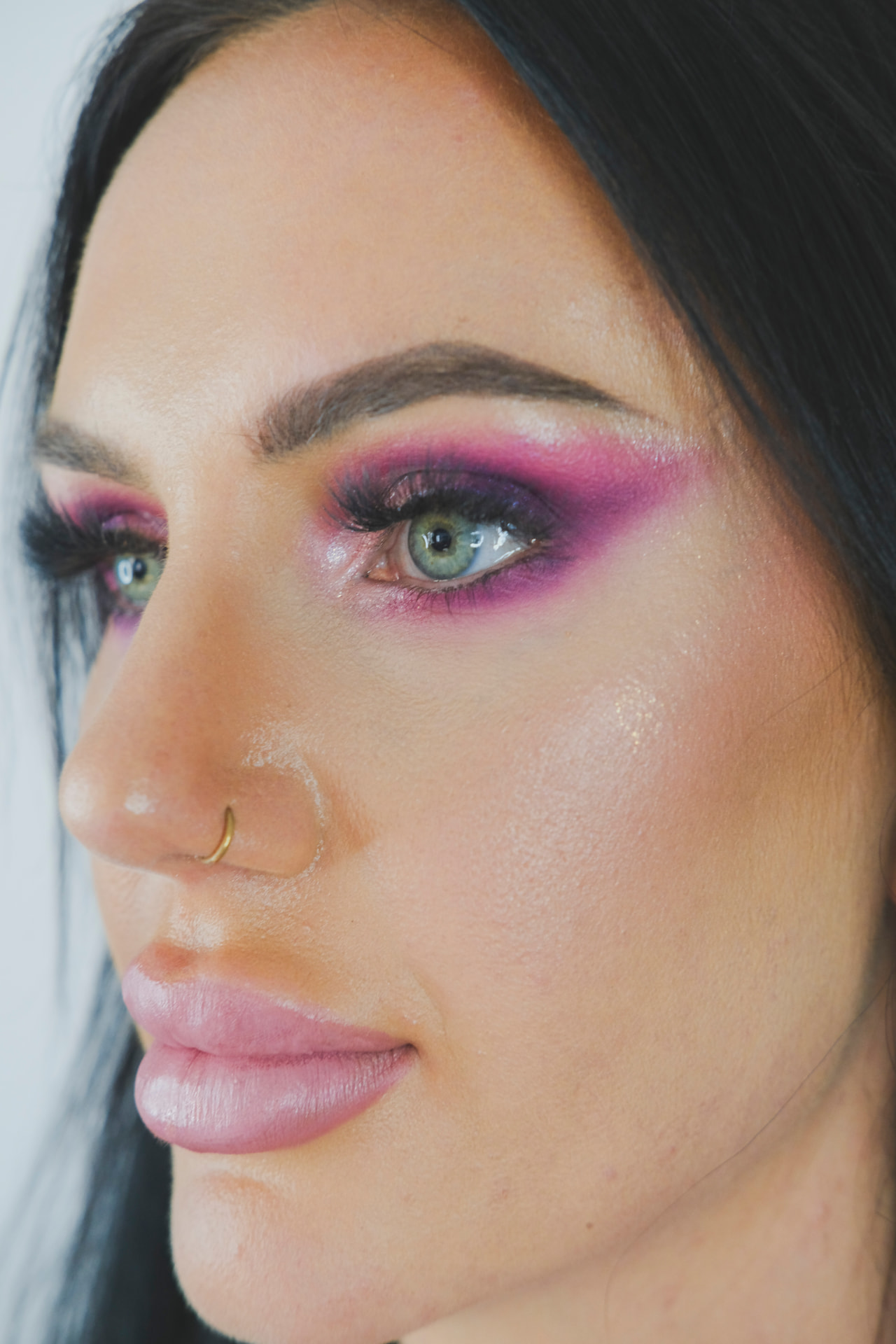 Vibrant pink and purple editorial eye makeup close up